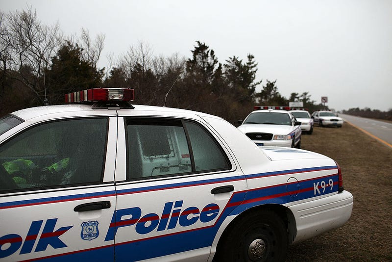 Police cars involved in the search effort sit on the side of the road along a stretch of beach highway on April 5, 2011 in Babylon, New York.