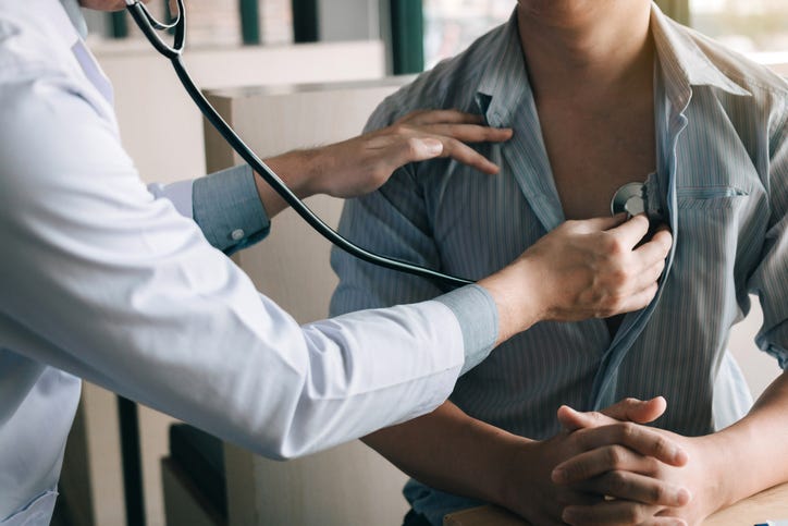 Man getting checkup with doctor