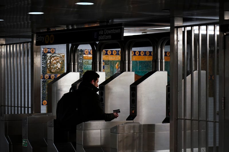 A customer swipes her metro card as she moves through the turnstiles at the Fulton Center subway station, February 27, 2019 in New York City.