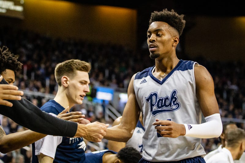 Jordan Brown #21 of the Nevada Wolf Pack slaps hands with teammates as he comes off the court during the game between the Nevada Wolf Pack and the Boise State Broncos at Lawlor Events Center on February 02, 2019 in Reno, Nevada.