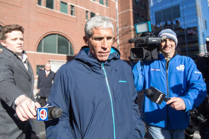 William "Rick" Singer leaves Boston Federal Court after being charged with racketeering conspiracy, money laundering conspiracy, conspiracy to defraud the United States, and obstruction of justice on March 12, 2019.