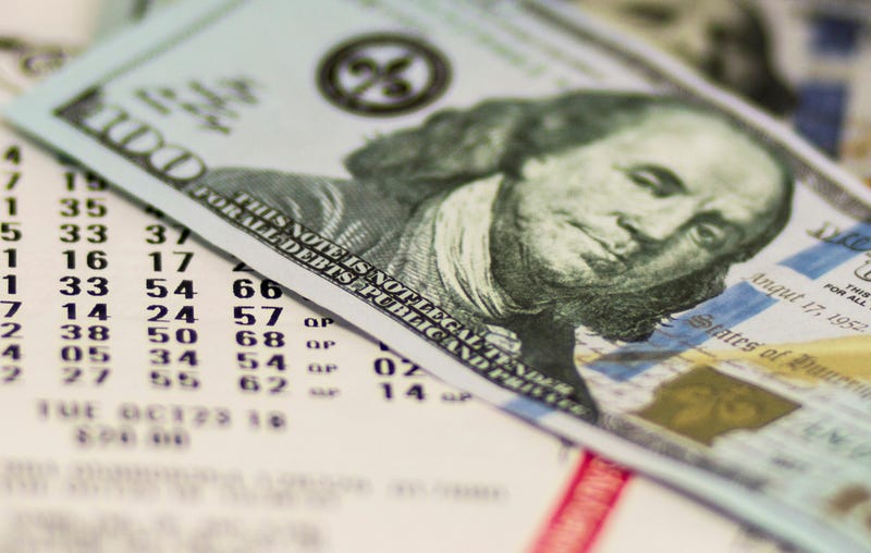 $100 bill on lottery ticket