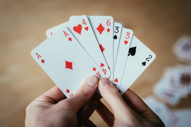 Man holding playing cards