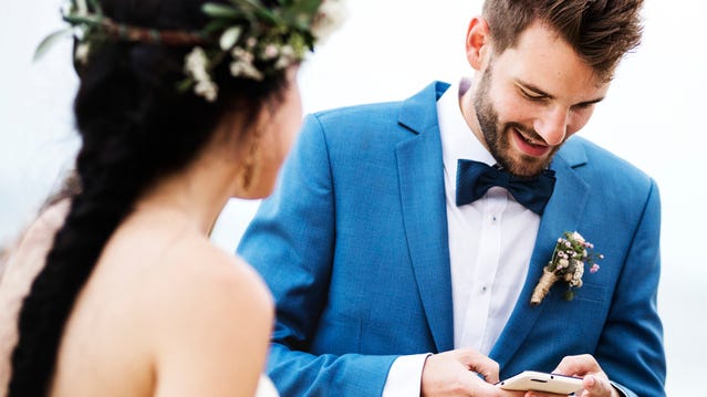 Groom caught checking his phone as bride walks down the aisle in viral TikTok video