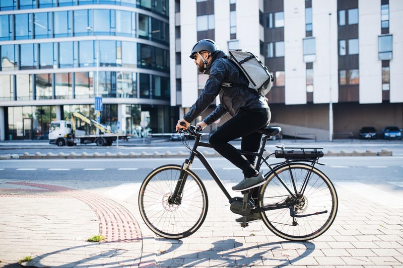 man riding his bike in the city