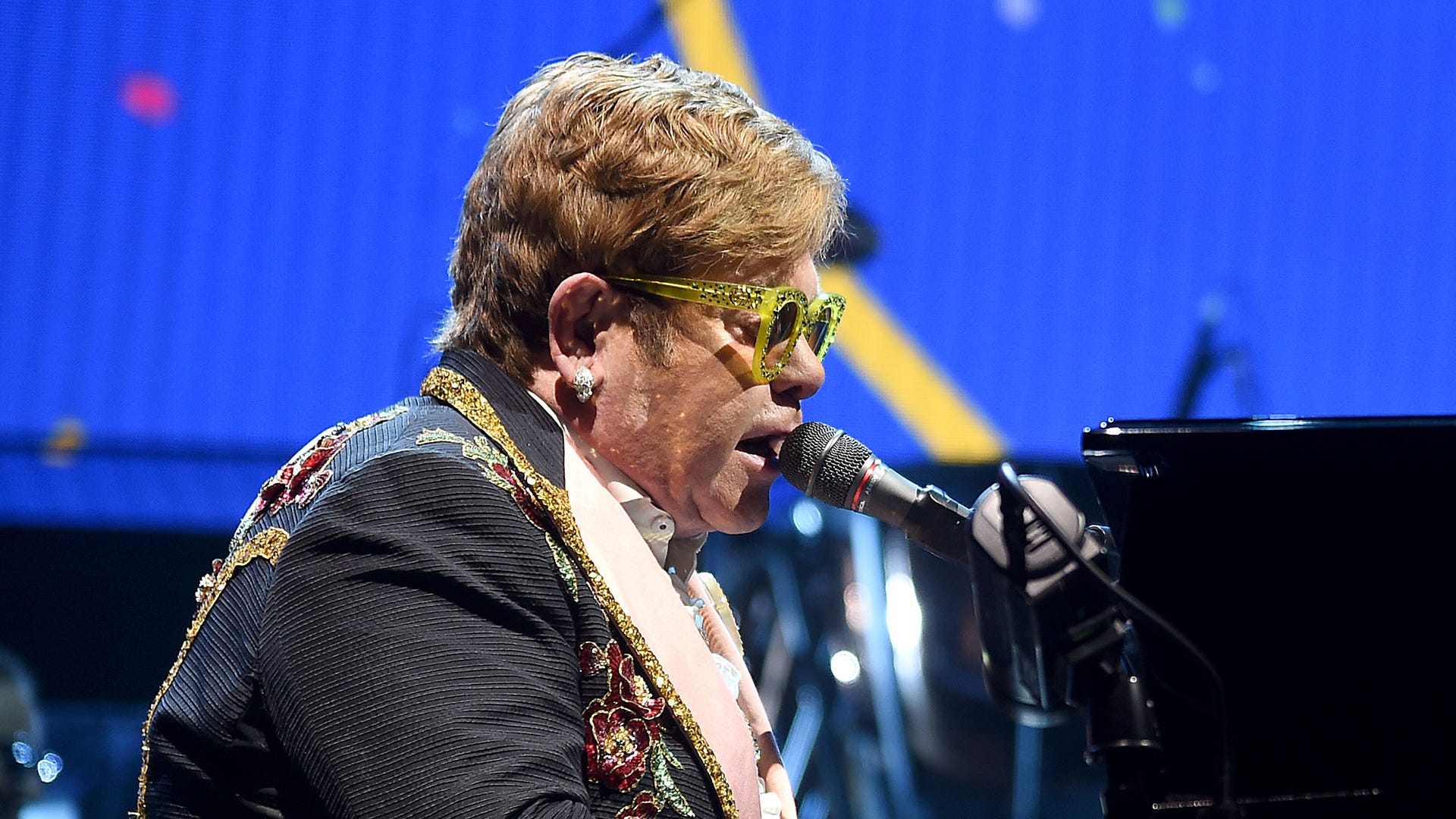 Elton John postpones tour dates, in 'considerable pain' after hip injury