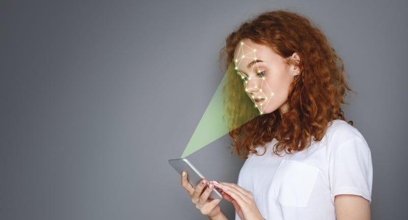 women's phone scans her facial features
