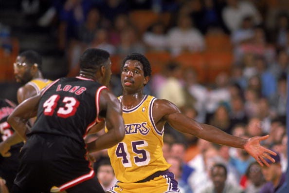 A.C. Green #45 of the Los Angeles Lakers guards Grant Long #43 of the Miami Heat during an NBA game at the Great Western Forum in Los Angeles, California in 1988