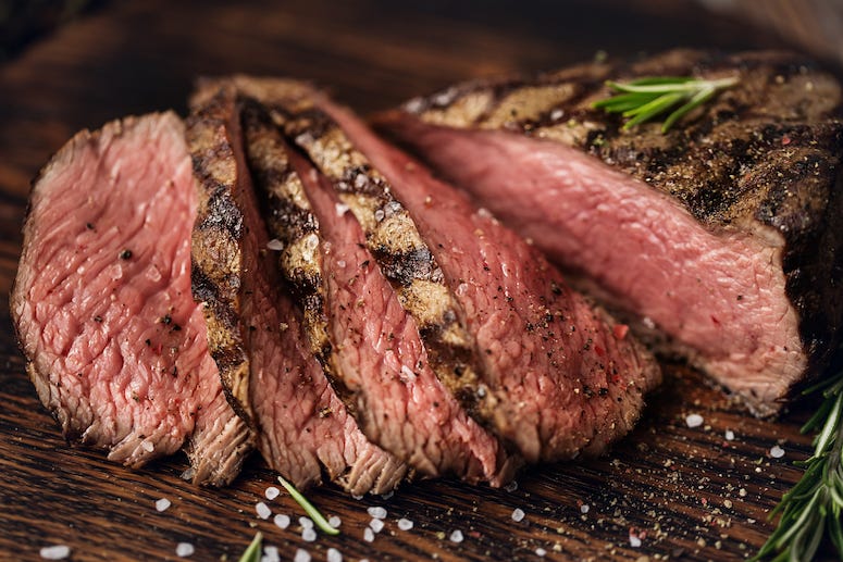 Steaks on board with spices