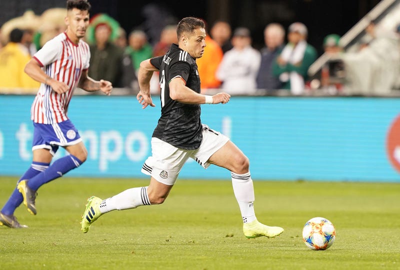 Javier Hernandez #14 of the Mexico National team dribbles the ball up field against Paraguay during the second half of their soccer game at Levi's Stadium on March 26, 2019 in Santa Clara, California. 