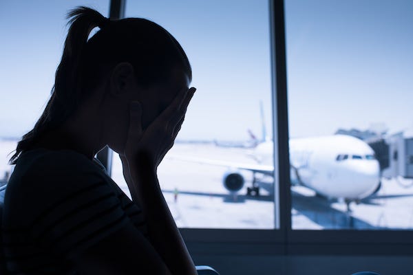 Stressed woman sitting in the airport