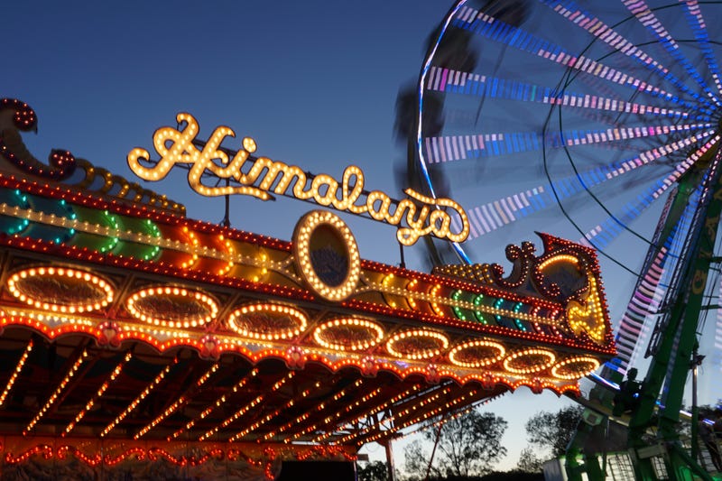 A ride and ferris wheel at the California State Fair. Sacramento, CA