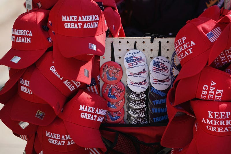 A vendor sells merchandise before the start of a rally with President Donald Trump at the Van Andel Arena on March 28, 2019 in Grand Rapids, Michigan.
