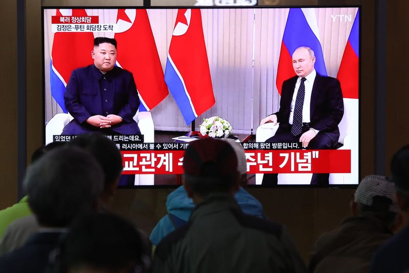 South Koreans watch a television broadcast reporting the North Korean Leader Kim Jong Un meeting with Russian President Vladimir Putin, at the Seoul railway station on April 25, 2019 in Seoul, South Korea.