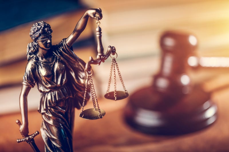 Lady justice with a gavel. 