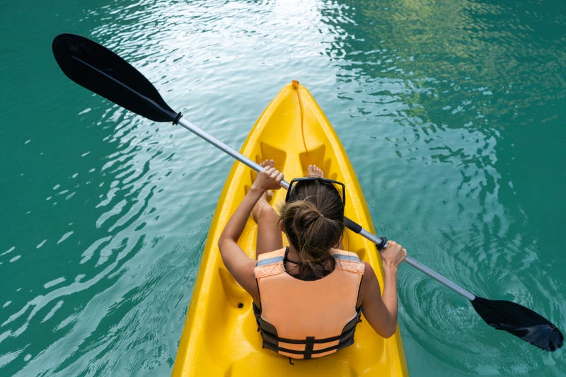 A kayaker wearing a life jacket.