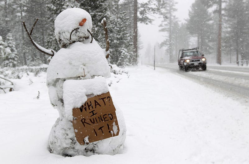 A snowman holds a sign along the race route on Highway 89 after stage one of the 2011 AMGEN Tour of California from South Lake Tahoe to North Lake Tahoe was cancelled due to unsafe conditions caused by snow on May 15, 2011 in South Lake Tahoe, California.