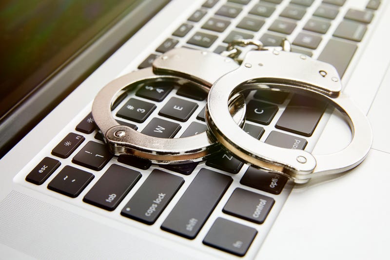 Handcuffs on computer keyboard