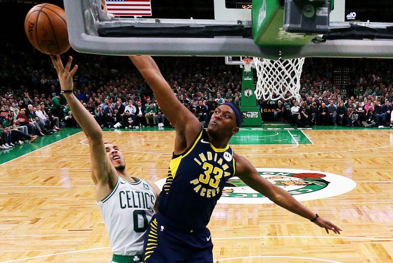 Myles Turner defends a layup attempt from Jayson Tatum.