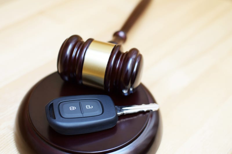 Stock photo of car key and gavel