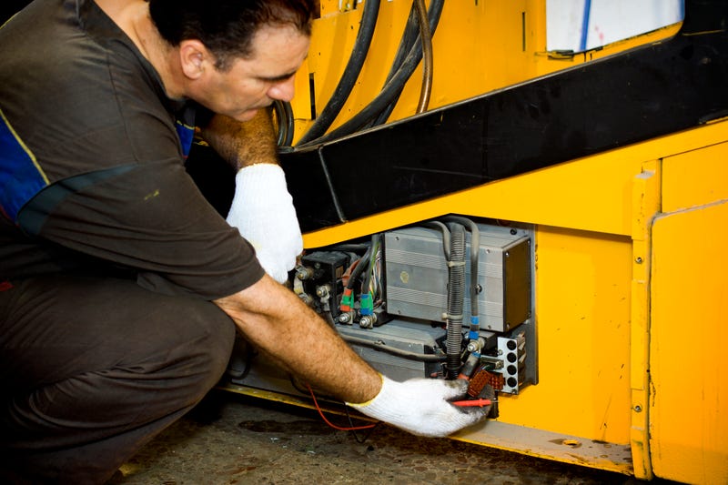 Mechanic working on a forklift.