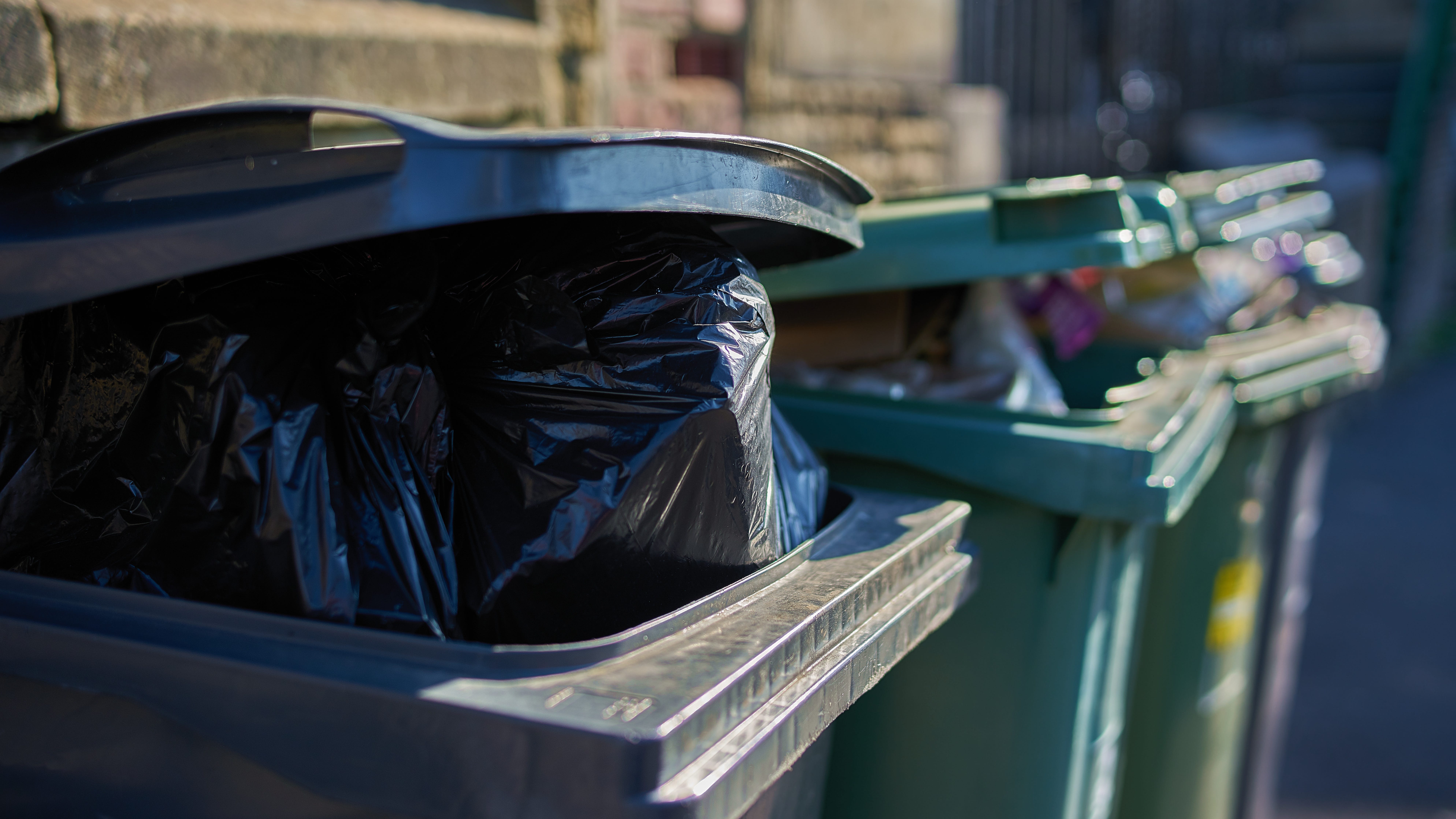 California man arrested after mom's body found in trash bin