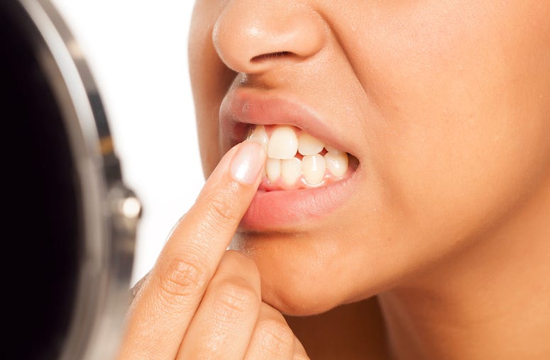 Woman looking at teeth