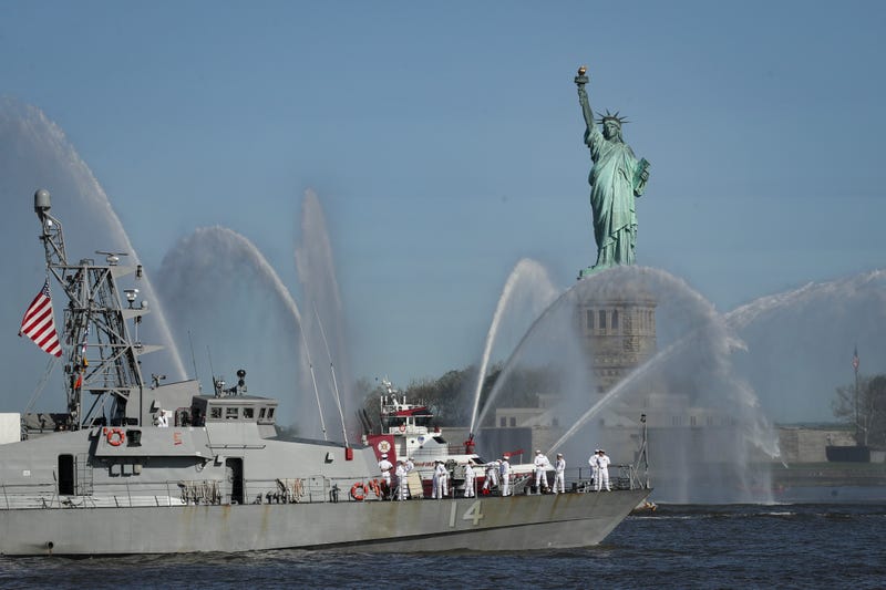 The USS Tornado sails past the Statue of Liberty during the Fleet Week Parade of Ships in New York Harbor, May 22, 2019 in New York City