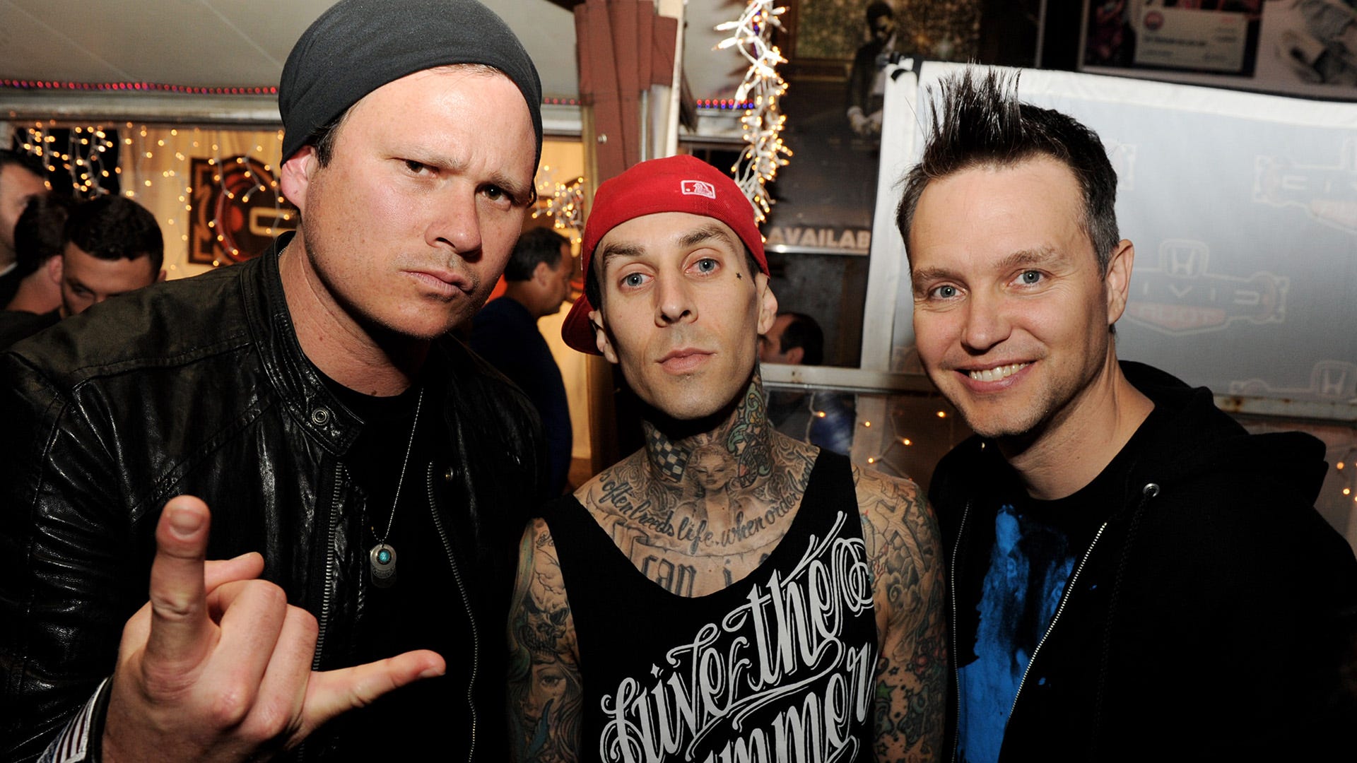 Mark Hoppus, Tom DeLonge admit they were mad that Travis Barker got the girls in Blink-182 videos