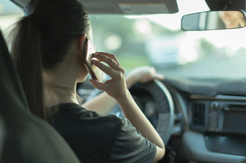 Teen talking on phone while driving