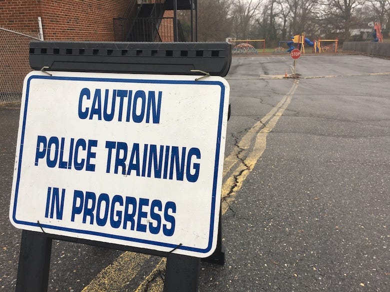 Police training in progress sign in front of school