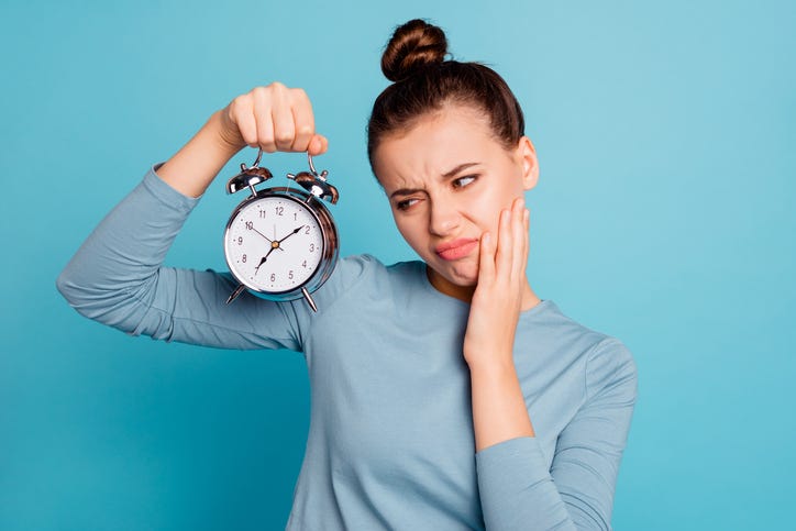 Girl Holding Clock