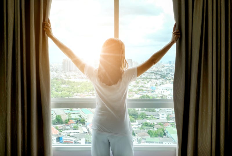 Woman looking out window