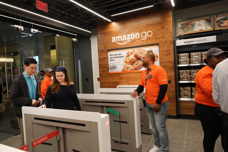 People shop at an Amazon go Store on May 07, 2019 in New York City.