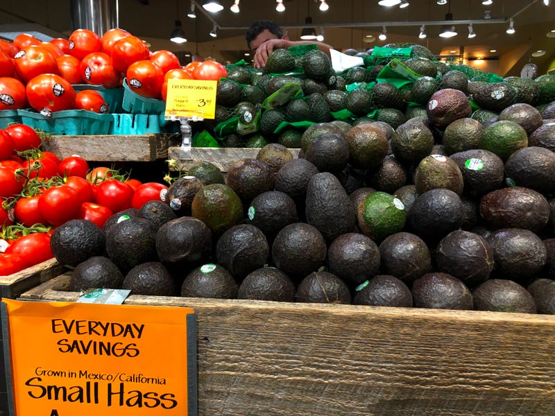 Avocados and tomatoes from Mexico are seen for sale in a store on June 6, 2019