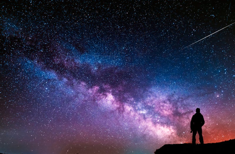 Man looking at night sky.