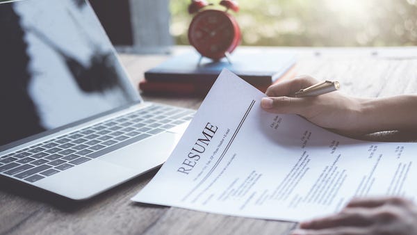 Woman prints résumé on cake for job application