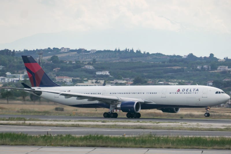 A Delta plane on the runway of JFK Airport.