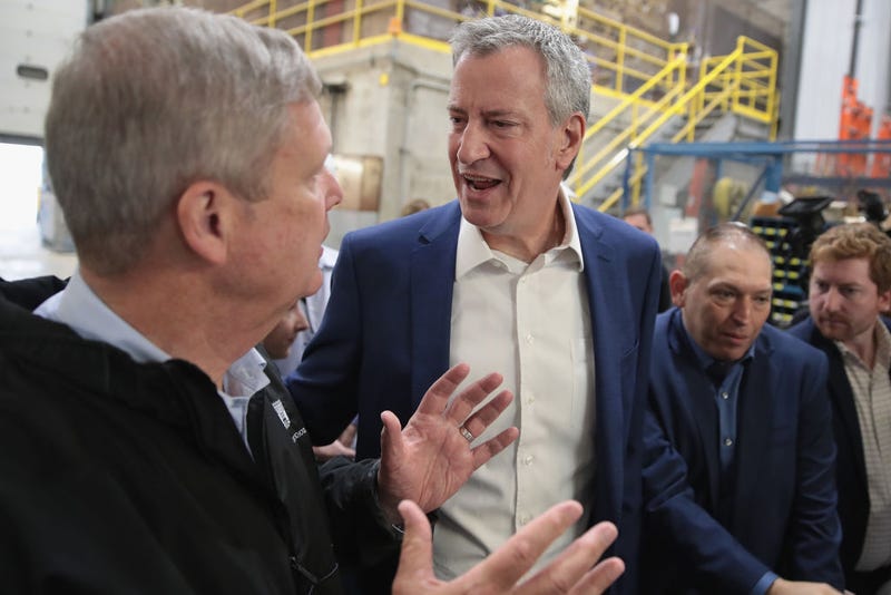 Democratic presidential candidate and New York City Mayor Bill De Blasio (R) tours the POET Biorefinery plant with former U.S. Secretary of Agriculture Tom Vilsack during a campaign stop on May 17, 2019 in Gowrie, Iowa.