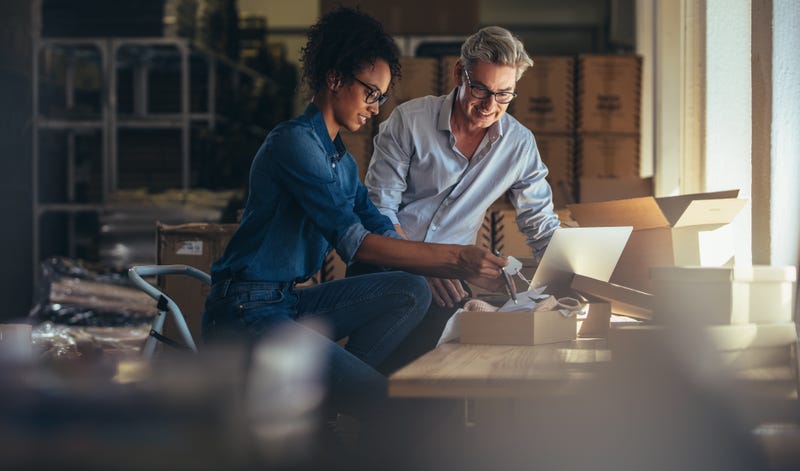 Small business owners working at warehouse