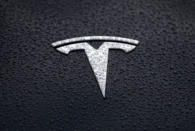 The Tesla logo is displayed on the hood of a Tesla car on May 20, 2019 in Corte Madera, California.