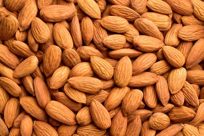 Semi hauling 40,000 pounds of almonds flips over on US-23 near Flint