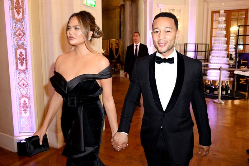 Chrissy Teigen and husband John Legend attend Pianists Lang Lang & Gina Alice Cocktail Wedding at Hotel Shangri-La in June 2019 in Paris, France.