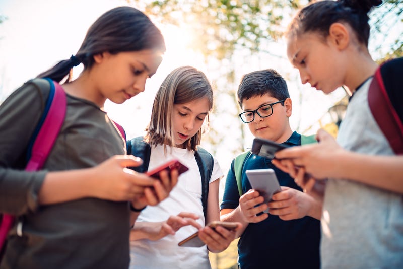 Kids on their cell phones