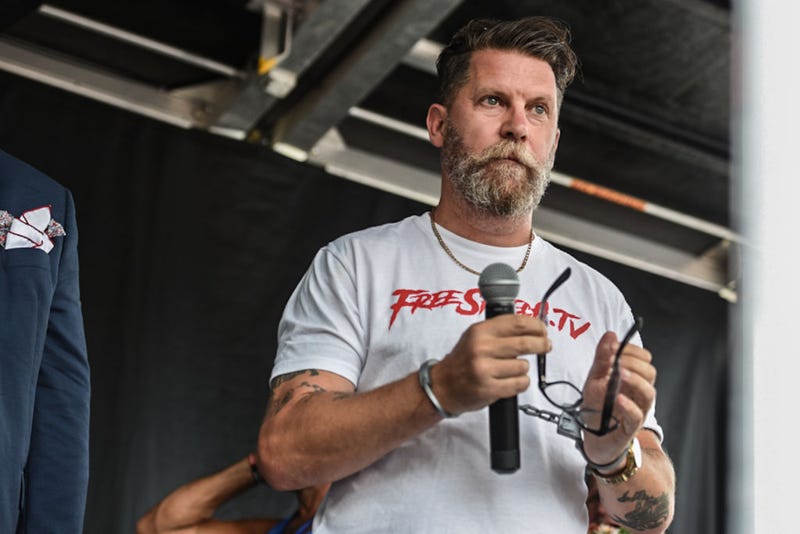 Gavin Mcinnes wears fake handcuffs backstage during a "Demand Free Speech" rally on Freedom Plaza on July 6, 2019 in Washington, DC.