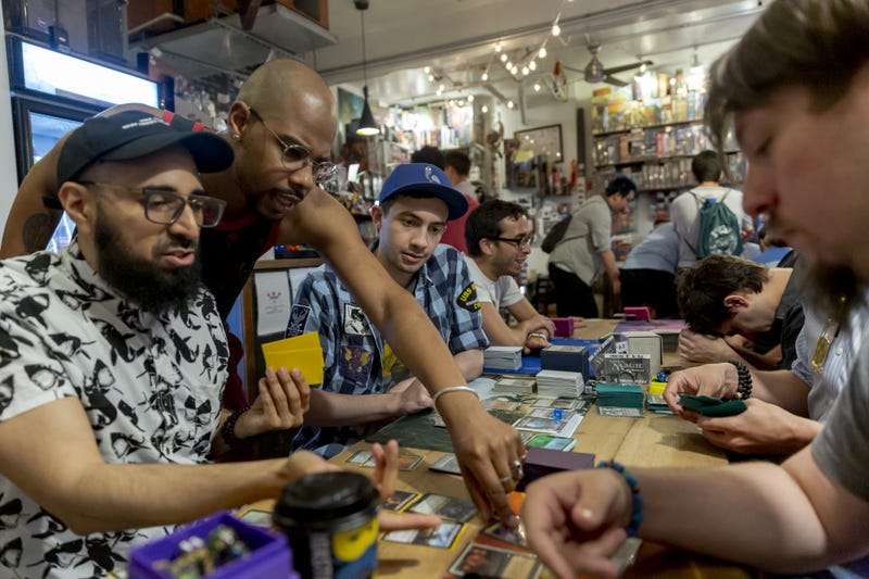 Fans play a Magic: The Gathering card game during a weekly tournament at the Uncommons hobby shop in New York, U.S., on Thursday, June 27, 2019.