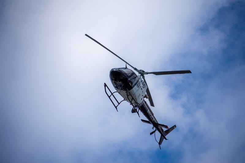 Northridge, CA / United States - May 27, 2019: LAPD Air Unit and Patrol Units respond to brandishing/ADW call in suburban neighborhood. Unit shown here is one of 10 American Eurocopter AS350 B2 A-Star helicopters the LAPD has in its fleet.