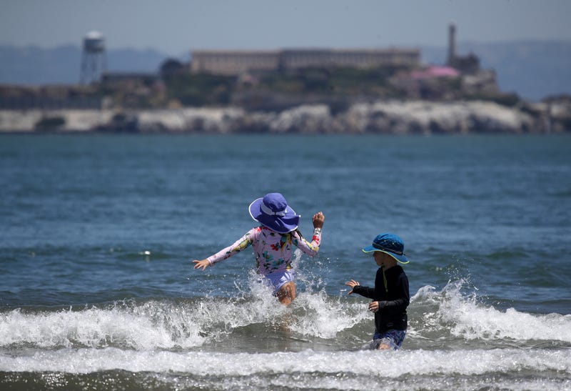 People play in the water at Crissy Field East Beach on June 11, 2019 in San Francisco, California.