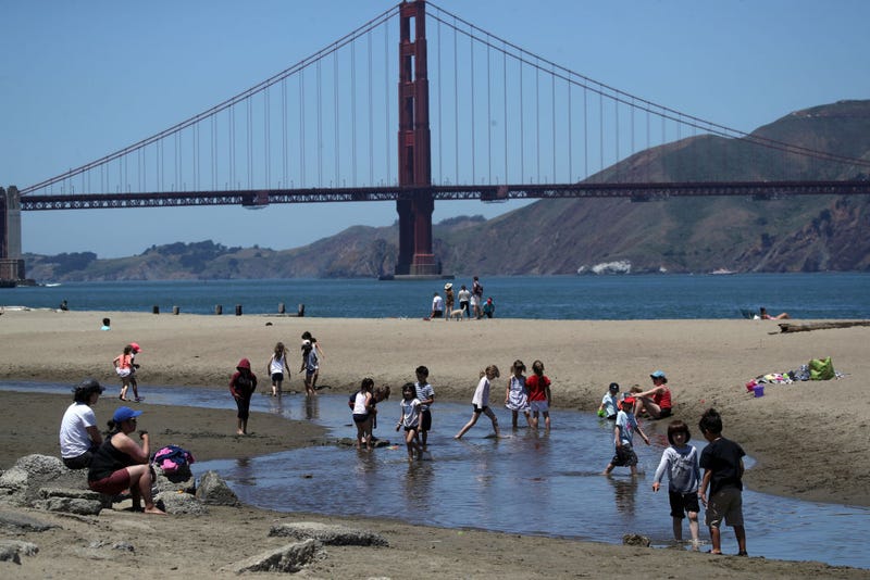 People play in the water at Crissy Field East Beach on June 11, 2019 in San Francisco, California.