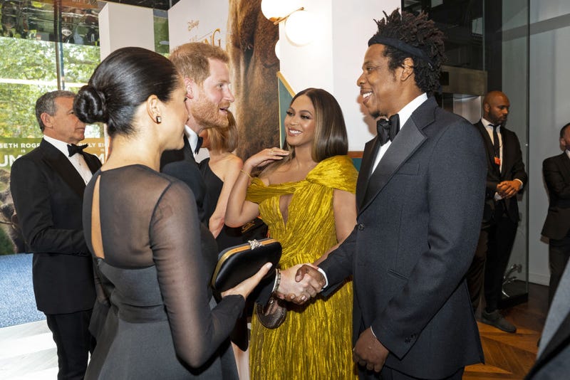 Prince Harry, Duke of Sussex (3rd L) and Meghan, Duchess of Sussex (2nd L) meet cast and crew, including Beyonce Knowles-Carter (C) Jay-Z (R) as they attend the European Premiere of Disney's "The Lion King" at Odeon Luxe Leicester Square on July 14, 2019 in London, England. 
